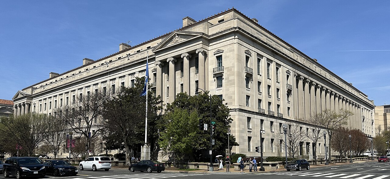 Department of Justice headquarters illustrating search epstein files by date in release batches